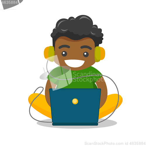 Image of African-american fat boy sitting with laptop.