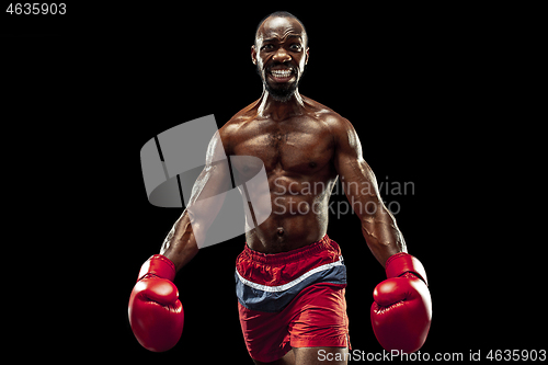 Image of Hand of boxer over black background. Strength, attack and motion concept