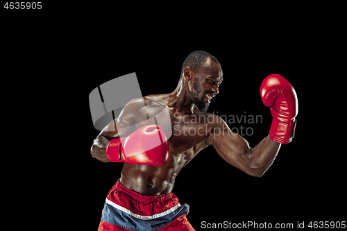 Image of Hand of boxer over black background. Strength, attack and motion concept