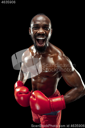 Image of Hand of boxer over black background. Strength, attack and motion concept