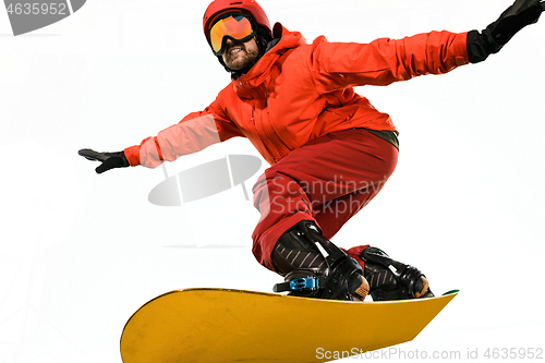 Image of Portrait of young man in sportswear with snowboard isolated on a white background.