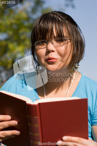 Image of Girl Reading A Novel