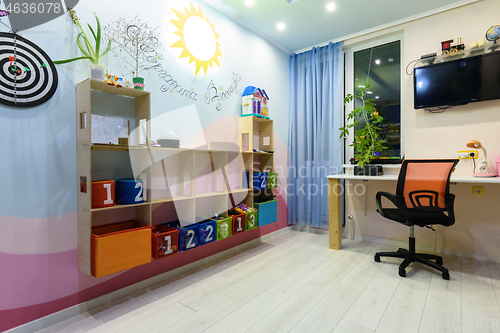 Image of Interior of a teenage children\'s room with shelves on the wall