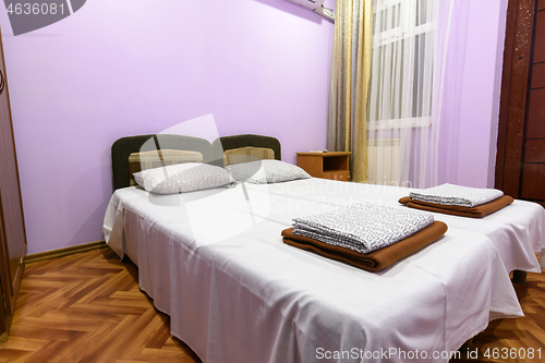 Image of Interior of a hotel room with a large double bed