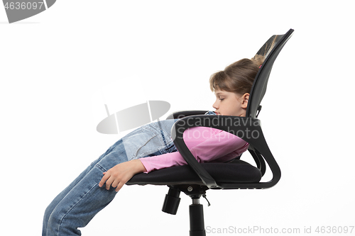 Image of Girl funny lay down in an office chair