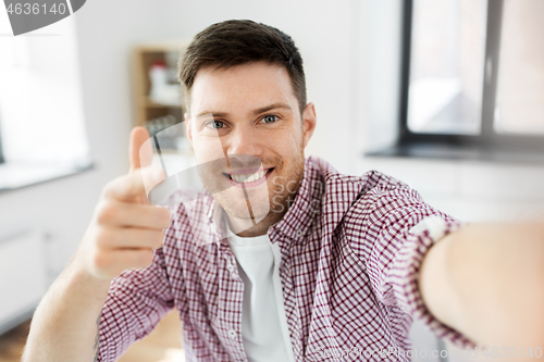 Image of man or video blogger taking selfie