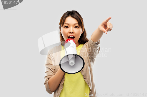 Image of asian woman speaking to megaphone