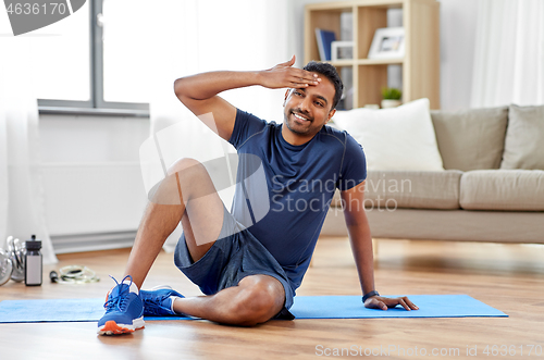 Image of tired indian man after training at home