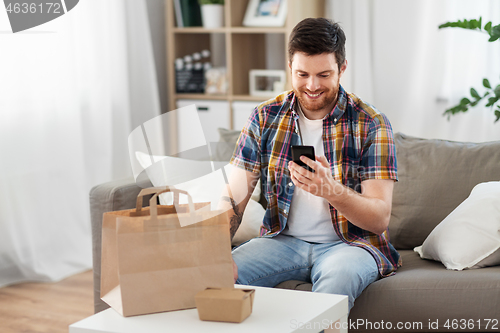 Image of man using smartphone for food delivery
