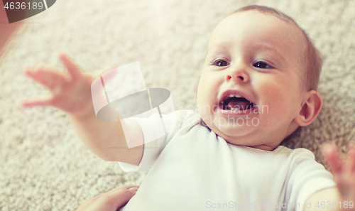 Image of close up of happy little baby and mother