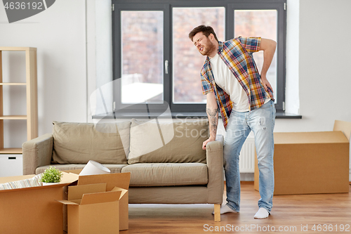 Image of man having back ache moving to new home