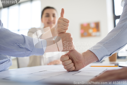 Image of group of business team making thumbs up gesture