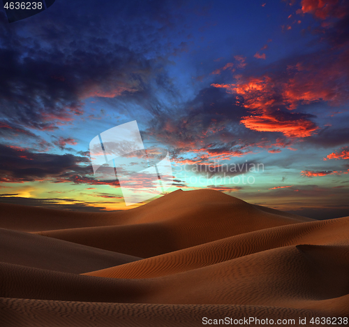 Image of sand dunes in desert at sunset