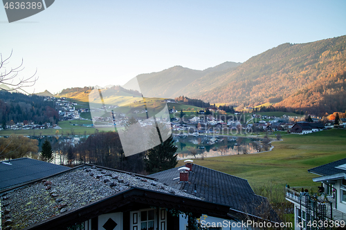 Image of Traditional rural landscape with houses, fields and mountains in Austria.