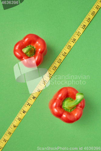 Image of Percent sign from red organic paprika pepper and measure tape.