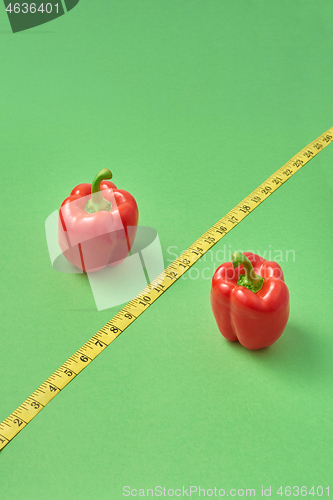 Image of Symbol of percent from red organic paprika pepper and measure tape.