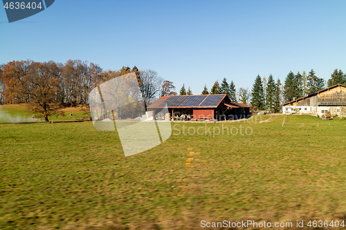 Image of Farming lands and buildings with solar panels on the roof, Austria.