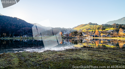 Image of Panoramic landscape with traditional houses on the bank of lake, Austria.