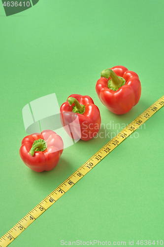 Image of Healthy set from fresh ripe red paprika pepper measuring tape.