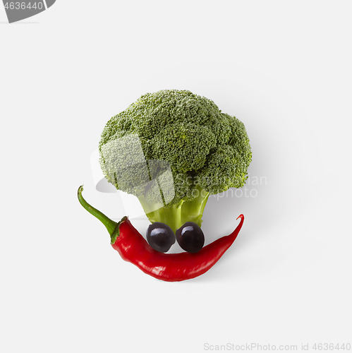 Image of Natural fresh vegetable composition in the shape of funny face.