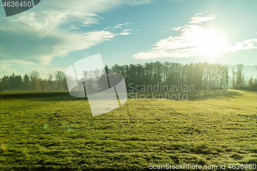 Image of Autumn landscape with farm agricultural fields and blue sky, Austria.