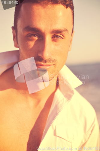 Image of young man at beach