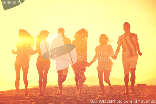 Image of happy young  people group have fun on beach