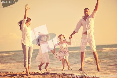 Image of happy young  family have fun on beach
