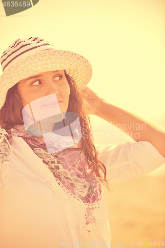 Image of happy young woman on beach