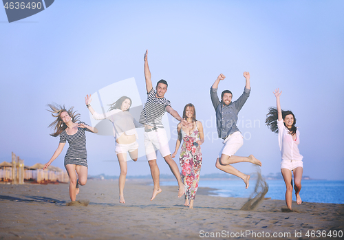 Image of happy young  people group have fun on beach
