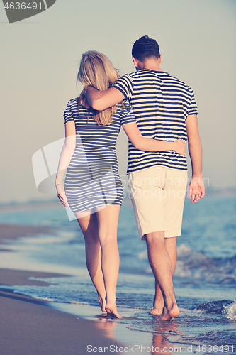 Image of happy young couple have romantic time on beach