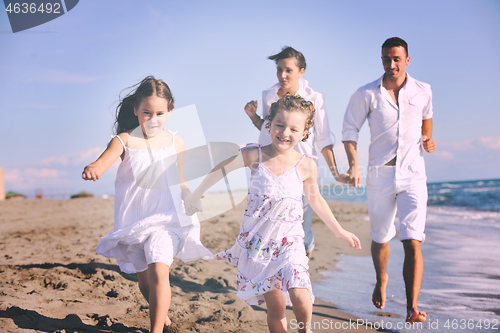 Image of happy young  family have fun on beach