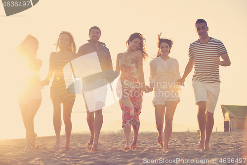 Image of happy young  people group have fun on beach