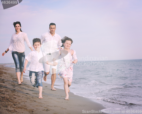 Image of happy young family have fun on beach