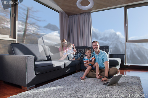 Image of Happy family playing a video game