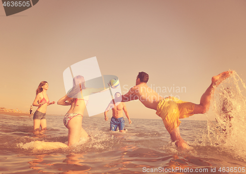 Image of young people group have fun and play beach volleyball