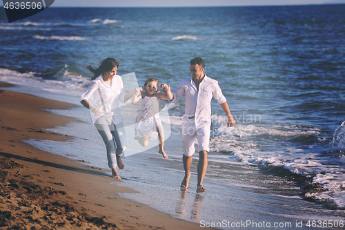 Image of happy young  family have fun on beach