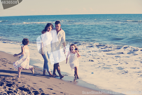 Image of happy young  family have fun on beach