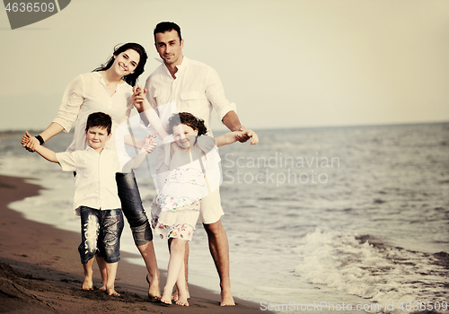 Image of happy young family have fun on beach