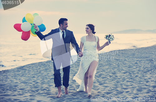 Image of romantic beach wedding at sunset