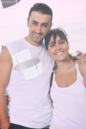 Image of happy young couple have fun at beautiful beach