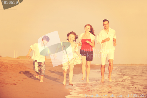 Image of happy young family have fun on beach