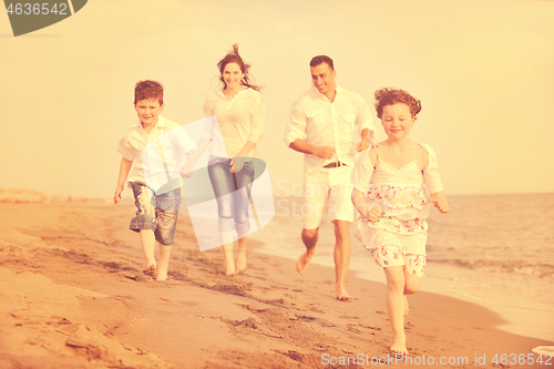 Image of happy young family have fun on beach