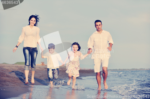 Image of happy young family have fun on beach