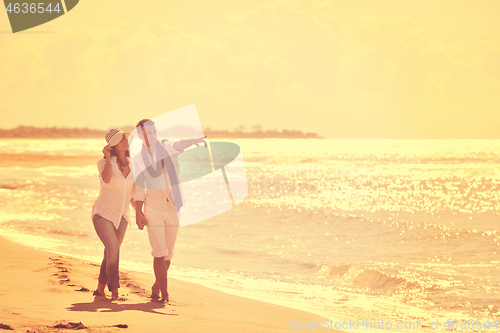 Image of happy young couple have fun at beautiful beach