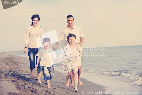 Image of happy young family have fun on beach