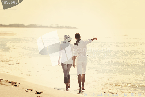 Image of happy young couple have fun at beautiful beach