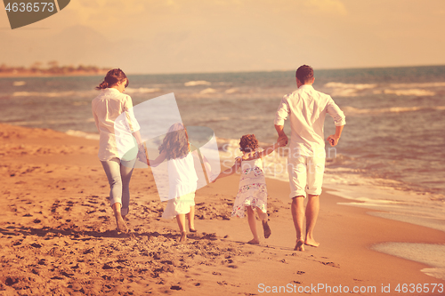 Image of happy young  family have fun on beach