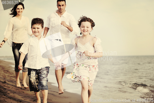 Image of happy young family have fun on beach