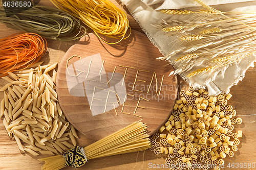 Image of Gluten free food. Various pasta, bread and snacks on wooden background from top view